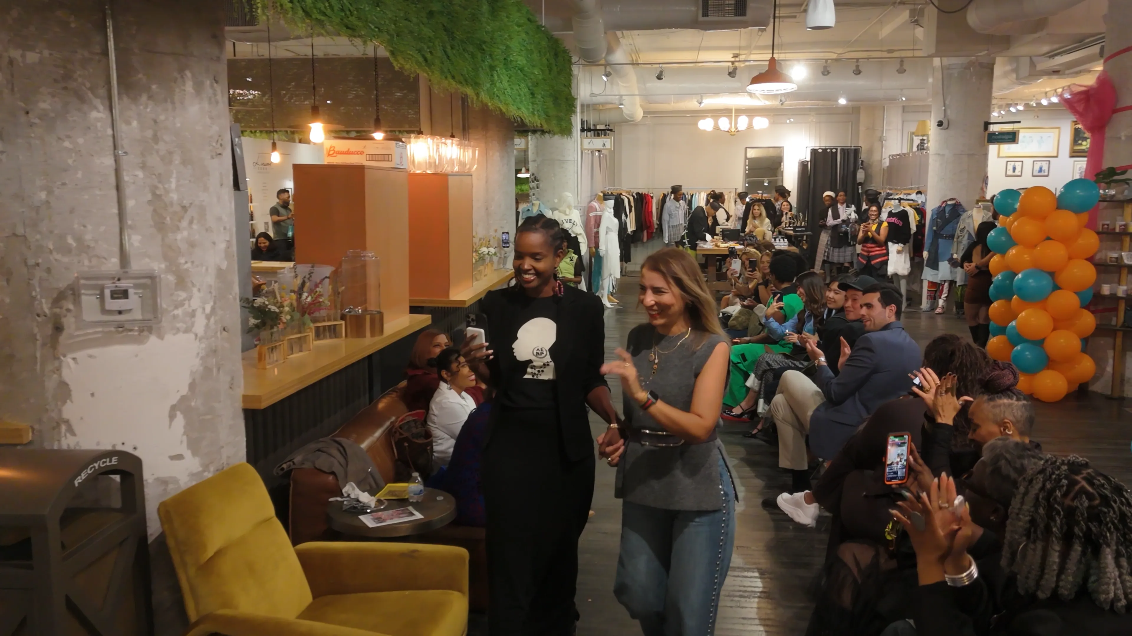Ayşegül Ikna with guests celebrating the fashion show launch at Ponce City Market